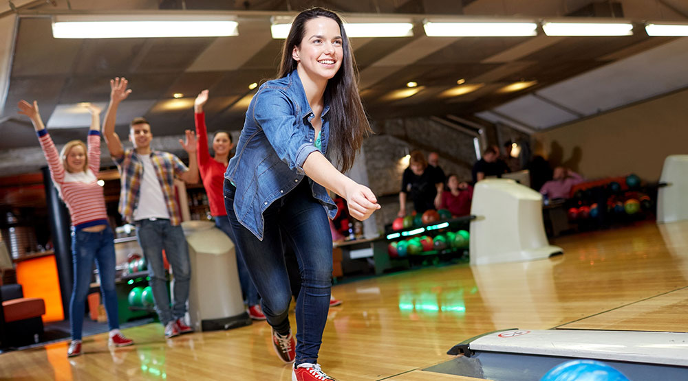 People bowling, an action shot of the kind this article argues for